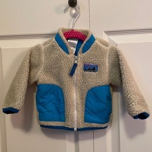 Patagonia blue and cream unisex 6 month infant fleece jacket.
